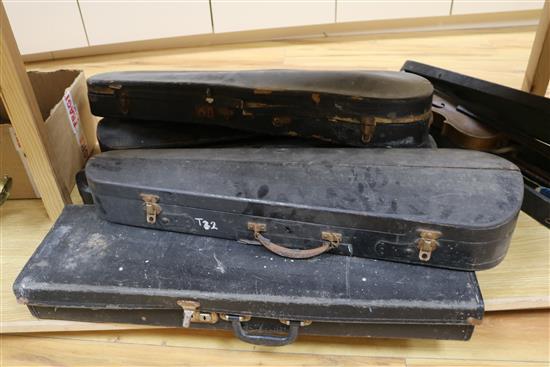 Three half size violins, a quantity of bows and six violin cases